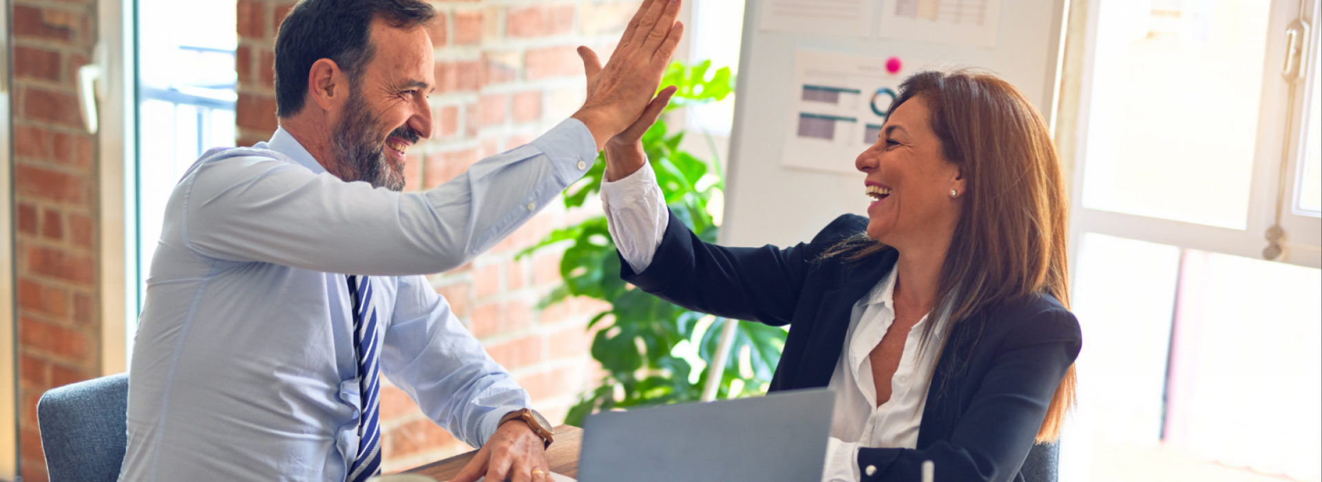 Women and man high five